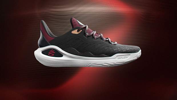 Side view of Stephen Curry's black, red, and white basketball sneakers.